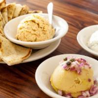 3 Spreads · Choice of three dips and served with warm pita bread.