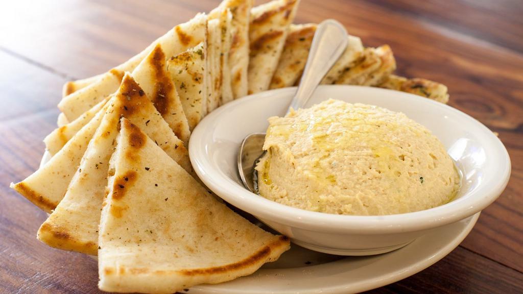 Hummus · Vegan, vegetarian, gluten-free. Chick pea dip, served with warm pita bread.
