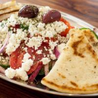 Horiatiki · Vegetarian. Greek salad with tomato, cucumber, red onions, feta and kalamata olives.