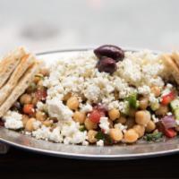 Revithosalata (Chickpea Salad) · Chopped tomato, cucumber, red onions, red peppers, crumbled feta.