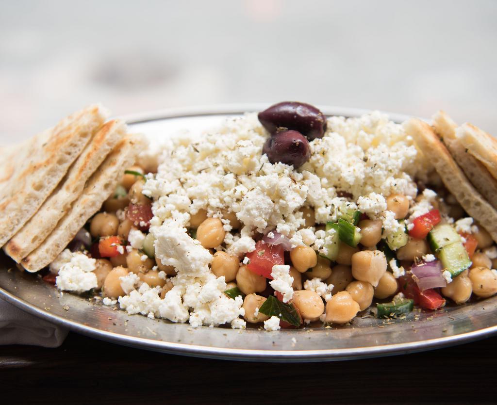 Revithosalata (Chickpea Salad) · Chopped tomato, cucumber, red onions, red peppers, crumbled feta.