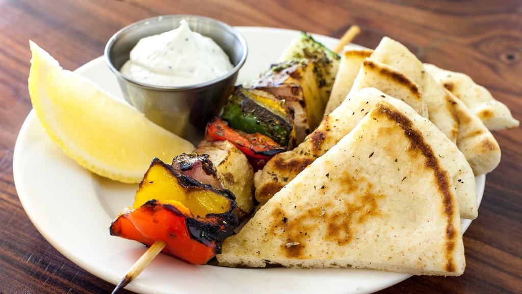 Veggie Skewer · Vegetarian, gluten-free. Eggplant, zucchini, colored peppers, and red onion. Served with tzatziki and pita.