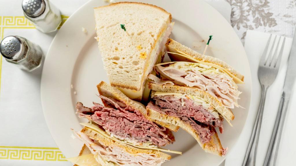 Turkey, Roast Beef & Swiss · Made with coleslaw and Russian dressing. All Swiss cheese, corned beef and turkey are imported.