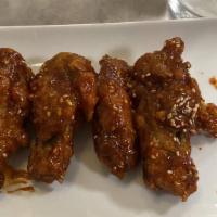 Seoulville K.F.C · Korean fried chicken. deep fried marinated chicken wings. sweet and spicy sauce or honey gla...