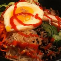 Dolsot Bibimbap · Assorted seasoned vegetable over rice served on a hot stone bowl. Choice :beef, chicken, tof...
