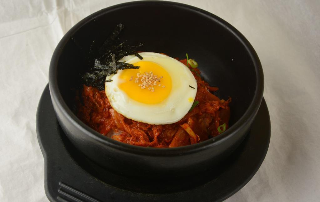 Dolsot Kimchi Fried Rice · Stir-fried kimchi over rice served on a hot stone bowl. Add beef, chicken, tofu for an additional charge.