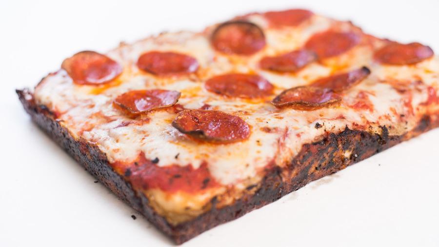 Craft Your Own (Pan Pizza) · Thick, homemade pizza squares-detroit pizza, Sicilian, or taglio- it's all pan pizza to us.