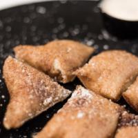 Dessert Dough · Lightly cooked cinnamon-sugar dough’(similar to fried dough), with confectionery sugar And c...