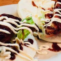 Pork Buns · Steamed buns with pork, tomato, lettuce, and spicy mayo.
