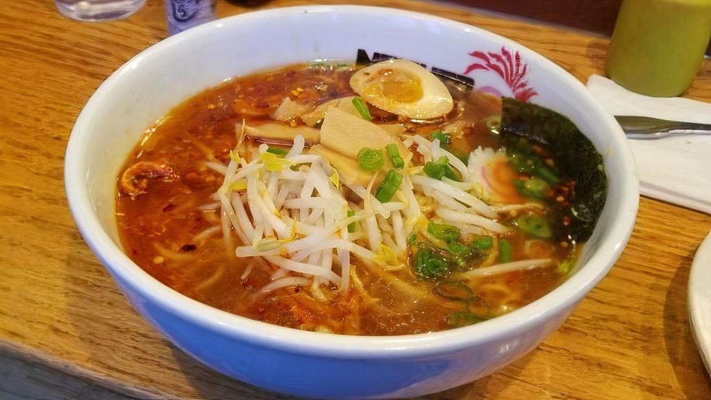 Naruto Ramen · Soy sauce based noodle soup with bean sprouts, fish cake, 
bamboo shoot, egg, scallion, dried seaweed, and roasted pork or chicken breast. (Pork and Chicken Broth)