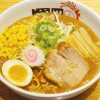 Curry Ramen · Curry based noodle soup with fish cake, scallion, corn, bamboo shoot, marinated soft boiled ...