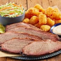 Smoked Brisket Plate · A generous serving of shredded or sliced Brisket with 3 pickle chips and 2 sides. And your c...