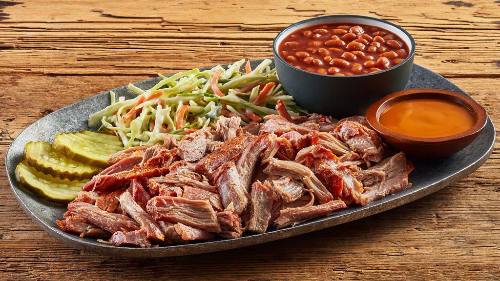 Pulled Pork Plate · Cooked slow and pulled apart to create a mouth-watering sensation. With 2 sides and 3 pickle chips plus your choice of sauce: Classic BBQ, Alabama white sauce or Carolina BBQ.