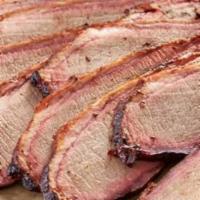 Smoked Brisket By The Pound · A full pound of mouth-watering sliced or shredded smoked brisket. Comes with four buttered a...