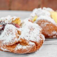 Cream Filled Pom-Pom · A cake donut filled with our Bavarian Creme covered in sugar!