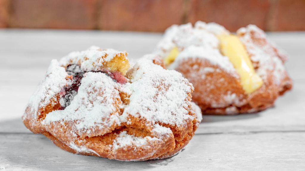 Cream Filled Pom-Pom · A cake donut filled with our Bavarian Creme covered in sugar!