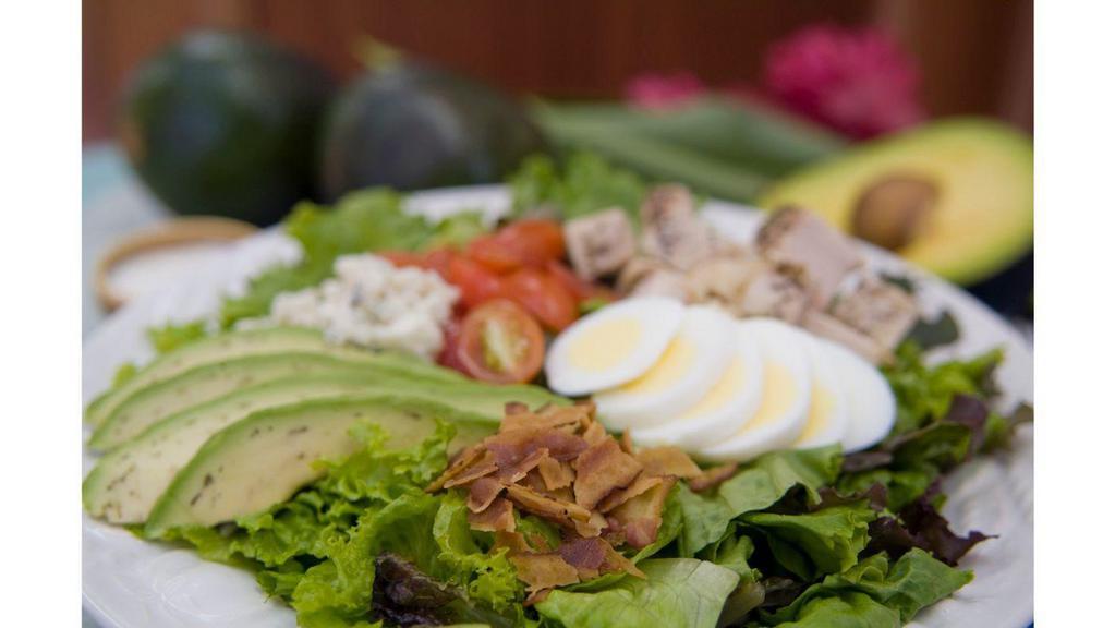 Kamuela Cobb · Grape tomatoes hard boiled egg bacon avocado bleu cheese mixed field greens herb ranch dressing and grilled chicken breast.