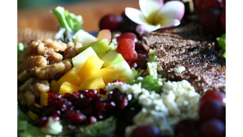 Aloha Passion  · Red grapes, green apples, mangoes, cranberries, candied walnuts, bleu cheese, mixed field greens and passion-orange vinaigrette .