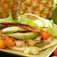 Vegan Pineapple Wrap · Vegan Chick'n, grilled pineapple, tomatoes, vegan bacon, avocado, veggie mayo, lettuce on ve...