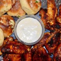 16 Wings, 6 Garlic Knots & 2 Dips · Jumbo, fresh, roasted wings with our freshly made Garlic Knots. Choose two flavors.