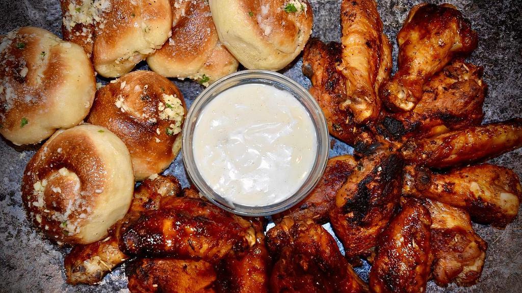 16 Wings, 6 Garlic Knots & 2 Dips · Jumbo, fresh, roasted wings with our freshly made Garlic Knots. Choose two flavors.