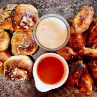 8 Wings, 6 Garlic Knots & 2 Dips · Jumbo, fresh, roasted wings with our freshly made Garlic Knots. Choose one flavor.