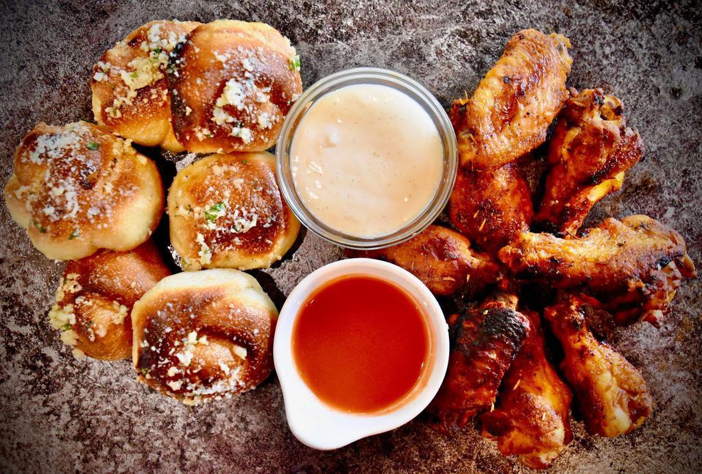 8 Wings, 6 Garlic Knots & 2 Dips · Jumbo, fresh, roasted wings with our freshly made Garlic Knots. Choose one flavor.