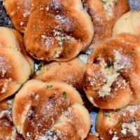 Garlic Knots · Fresh baked knot baked in our coal fired oven. Topped with garlic, olive oil, fresh parsley ...