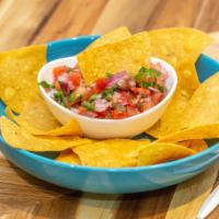 Chips And Pico De Gallo · Hand cut salsa from tomato onion jalapeno cilantro and lemon juice with house made corn tort...
