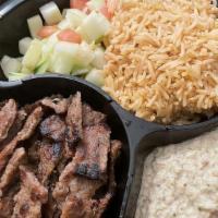 Lamb Gyro Platter · Juicy lamb strips cooked over a charcoal grill and served on a bed of fluffy rice, with any ...
