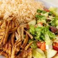 Chicken Shawarma Platter · Dark meat chicken stacked, spiced, spit-roasted and sheared, served on a bed of fluffy rice,...