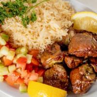 Lamb Tikka Kabab Platter · Served with rice, pita, two sides and sauce.