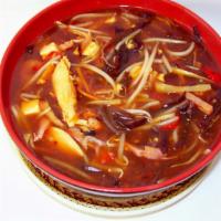 Hot And Sour Soup · Served with crispy noodles. Hot and spicy. Spicy.