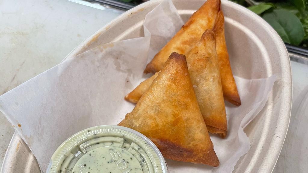 Vegetable Samosas (3Pcs) · Filled with potatoes,chic peas, red chili, coriander, mint leaves, green chili, cumin seeds, ginger, garlic, onion, and salt. (contains wheat).