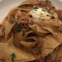 Pappardelle Con Osso Bucco · Ribbons of pasta in a braised veal shank and rosemary sauce finished a hint of cream and min...