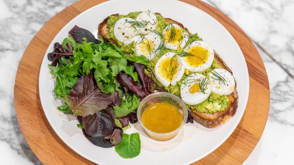 Avocado Toast · Soft egg and dill on sourdough  with a side of greens &  vinaigrette.