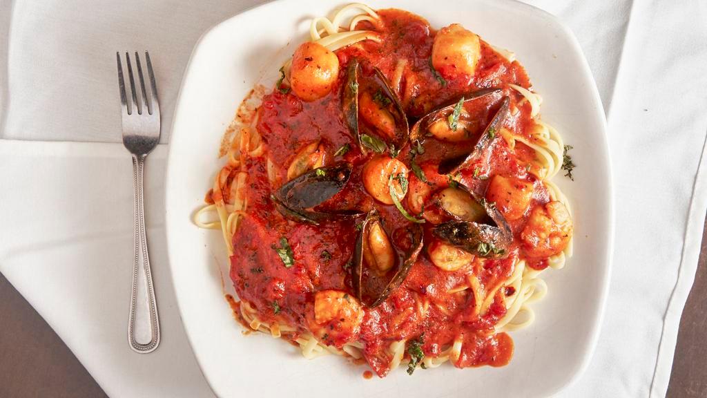Pesce Diavolo · Linguine, sauteed shrimp, scallops, mussels with a spicy white wine marinara sauce.