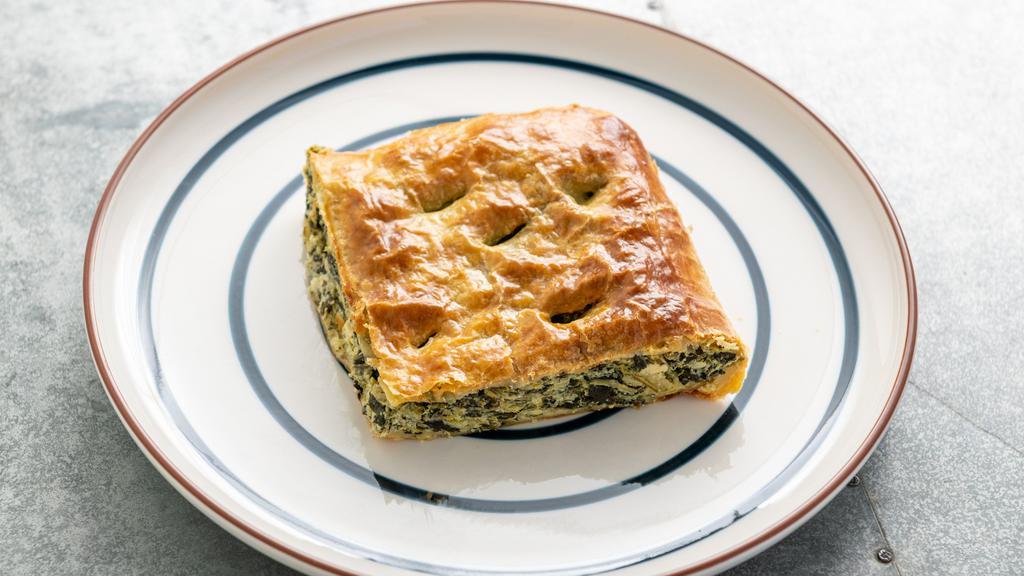 Spanakopita · Authentic spinach pie wrapped in a housemade phyllo.