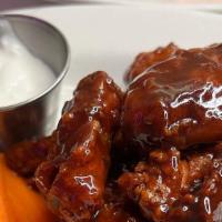 Bbq Or Buffalo Wings · Eight pieces of crispy fried wings served with blue cheese dressing, carrot and celery sticks.