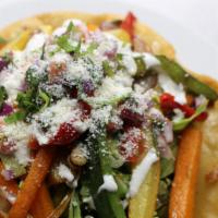 Taco Salad · Mixed greens, pico de gallo, pinto beans, guacamole, cotija cheese.