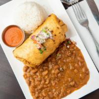 Chimichanga · Deep fried flour tortilla stuffed with cheese, pico de gallo topped with sour cream and red ...