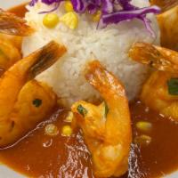 Shrimp Al Tequila · Grilled shrimp with chipotle and tequila sauce served with yellow rice.