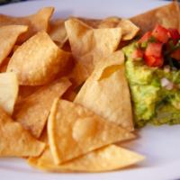 Premium Guacamole · Homemade tortilla chips served with guacamole and topped with pico de gallo.