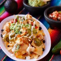 Nachos  · Order of nachos served with black beans, shredded cheese, pico de gallo, guacamole, cheese s...