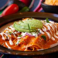 Malinche'S Enchiladas · Enchiladas in a roasted tomato-chipotle cream sauce. Topped with melted cheese, red onion, a...