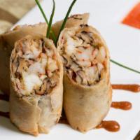 Lobster And Shrimp Spring Roll · with Shiitake Mushrooms and Spicy Pineapple Sauce.