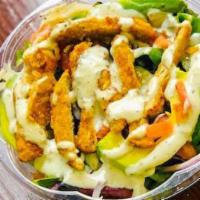 Chick'N Caesar Salad · Mixed salad, avocado, tomato, red onion, lemon, chick'n, caesar dressing, vegan parmesan che...