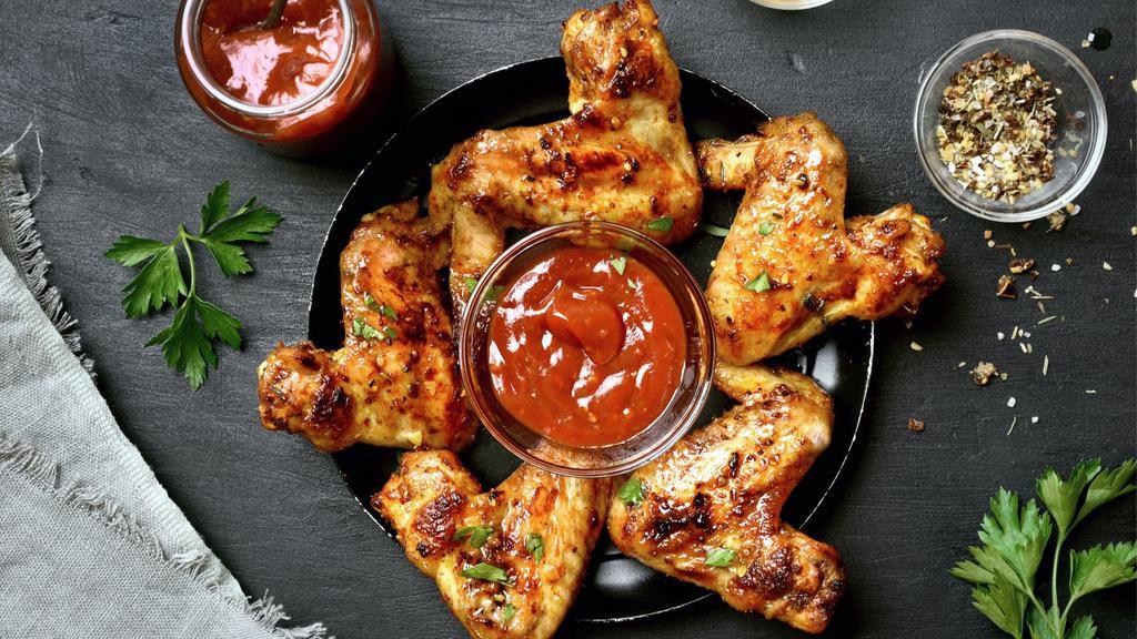 Barbeque Chicken Wings · Oven-baked chicken wings tossed in sweet barbeque sauce. Served with carrots and celery.