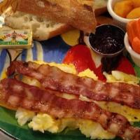 Special Breakfast · Pancakes or french toast with two eggs, bacon, ham and sausage. Served with butter and syrup.