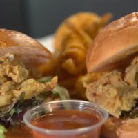 Buffalo Chicken Sliders · Crispy fried chicken, with coleslaw, on guava buns all with our House-made buffalo ranch sau...